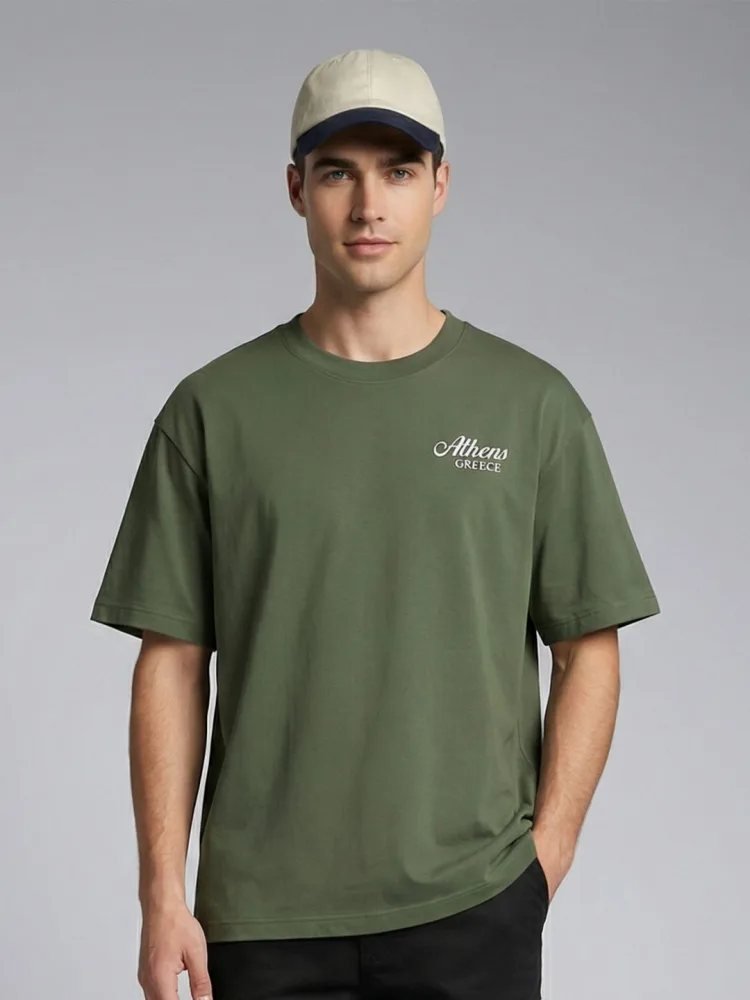 Camiseta Oversize Modern House Verde Militar — vista frontal